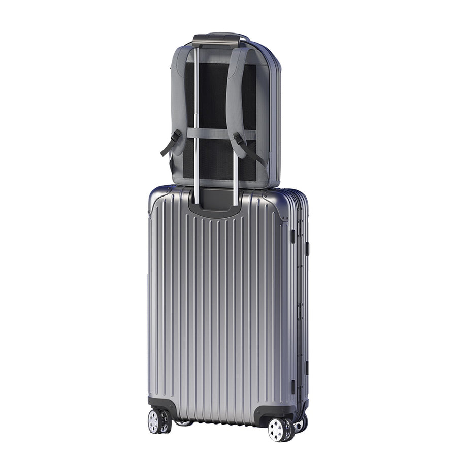 LINKSOLAR 30W solar backpack secured over the handle of a rolling suitcase