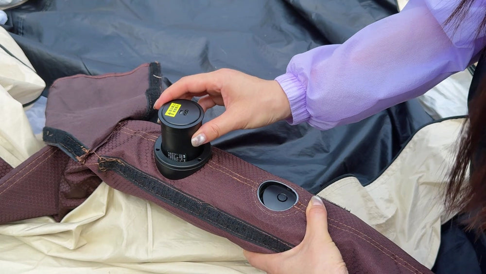 Camper using the built-in pump to inflate the LINKSOLAR tent body