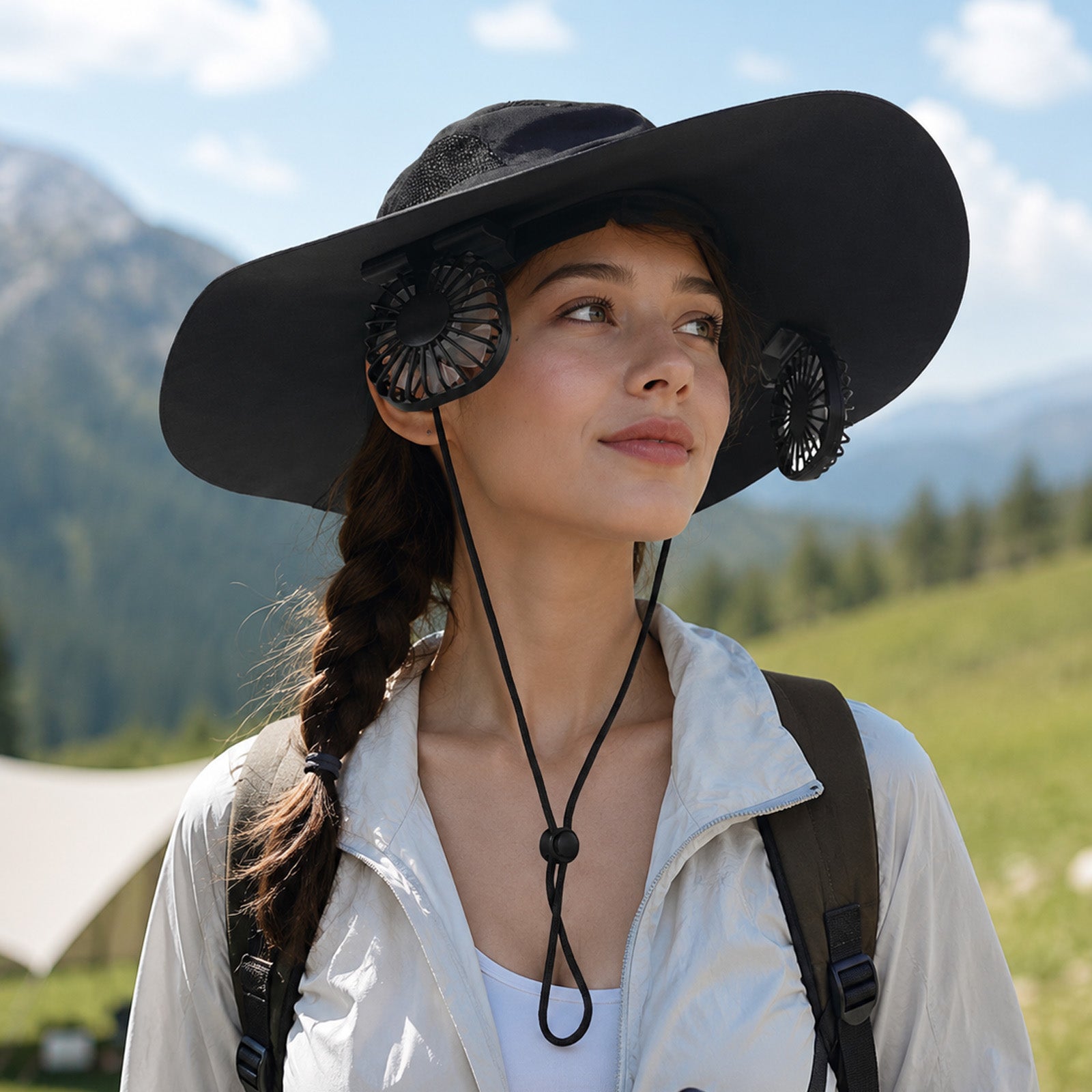 Hiker wearing the LINKSOLAR F2 Solar Fan Hat in a mountain setting