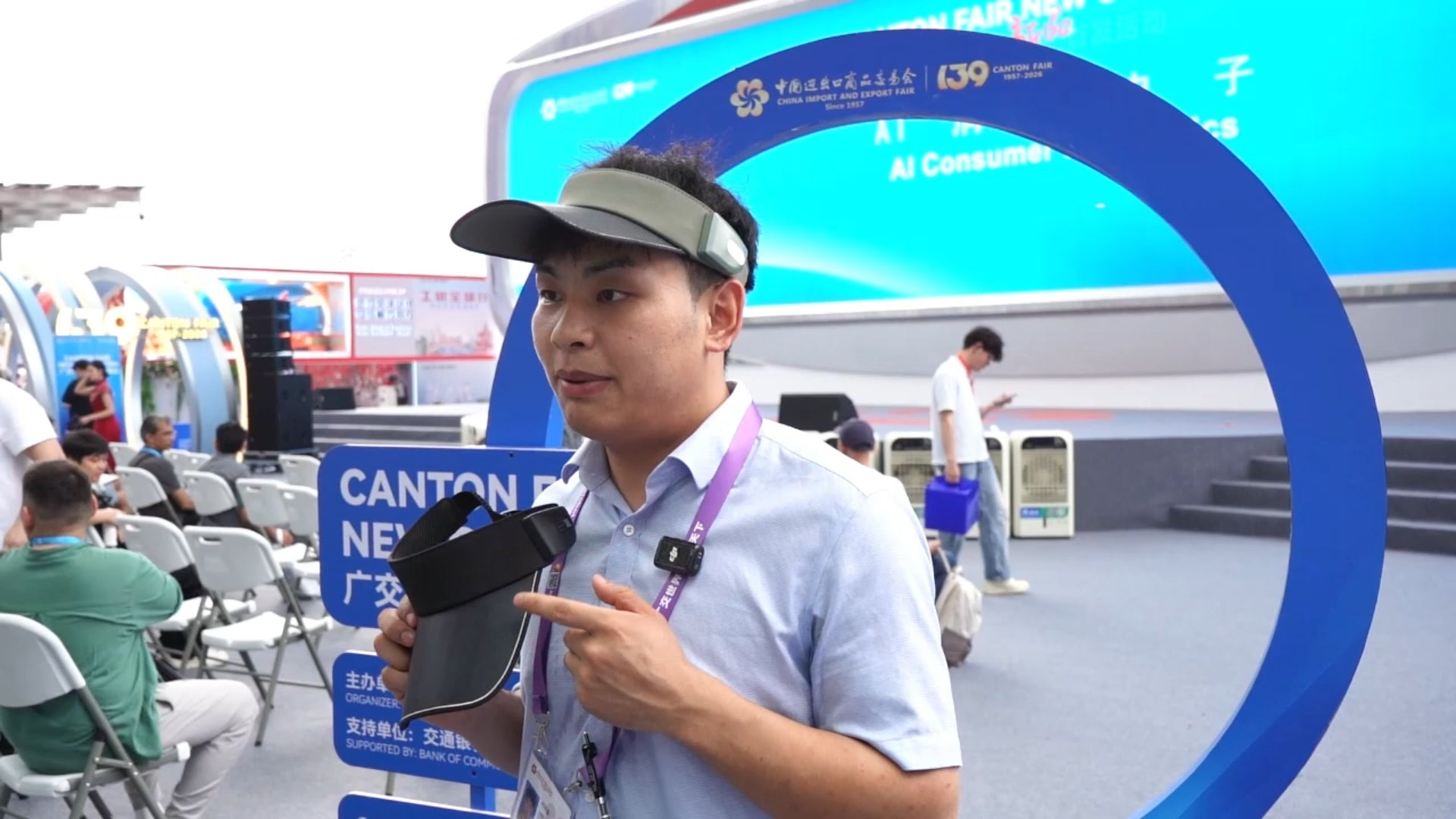 LINKSOLAR team demonstrating a solar audio visor at an outdoor industry event