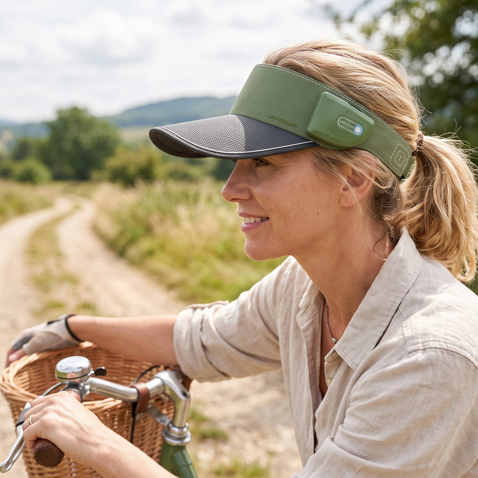 Woman cycling in the green LINKSOLAR Solar Audio Visor