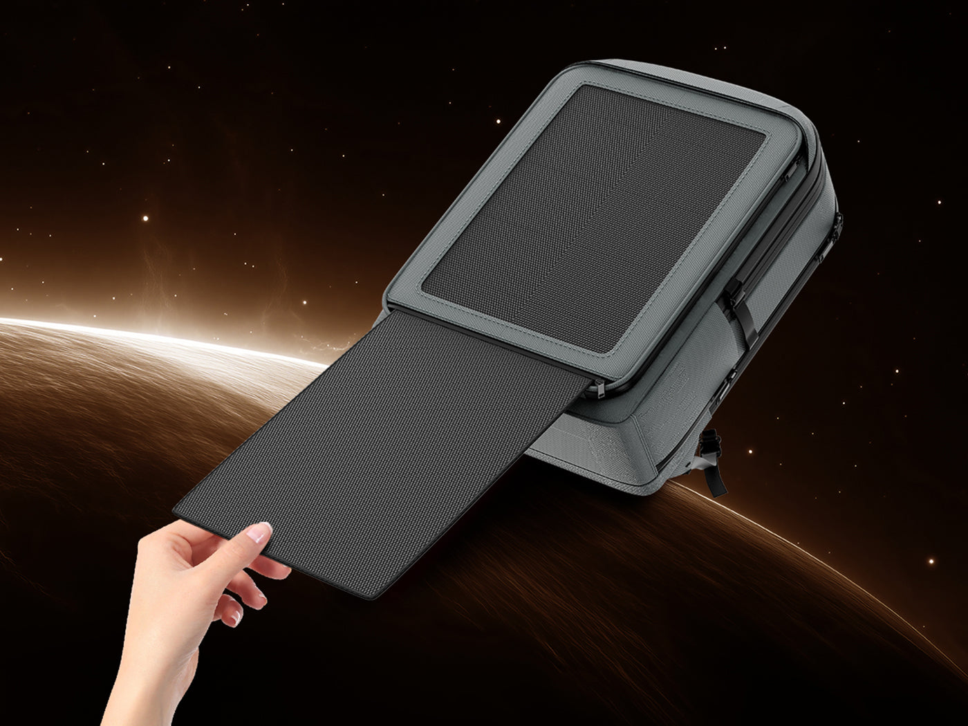 Hand pulling the hidden second 15W solar panel from the bottom of the LINKSOLAR PT-B-30W backpack