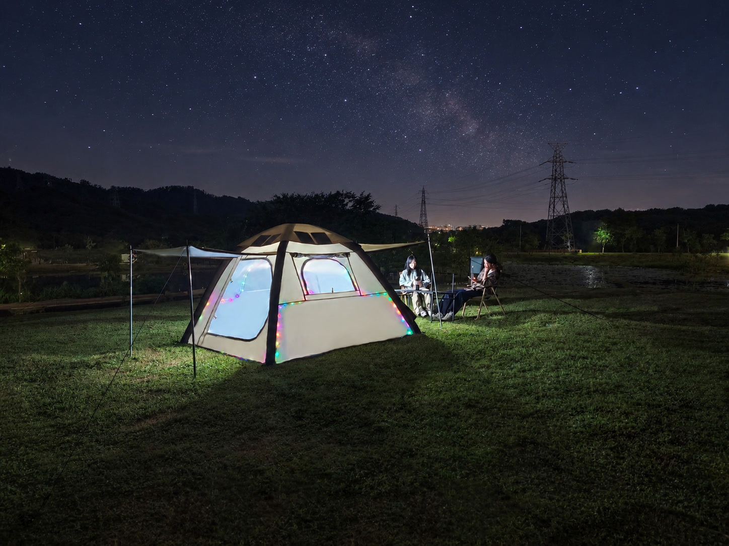 LINKSOLAR inflatable camping tent illuminated at a nighttime campsite